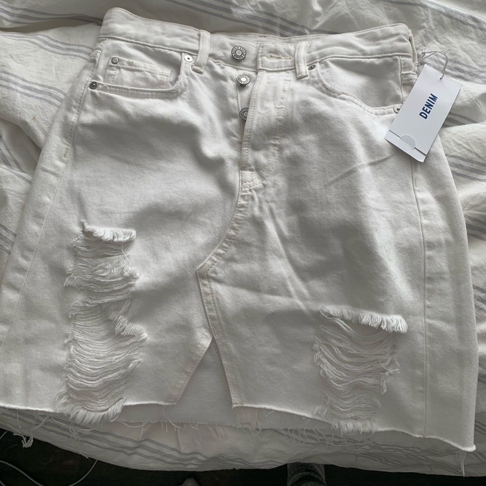 Distressed denim mini skirt